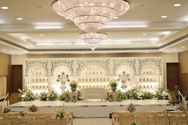 Grand ballroom floral stage at Siddharth Banquets